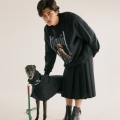 man in boots looks cool standing with black greyhound
